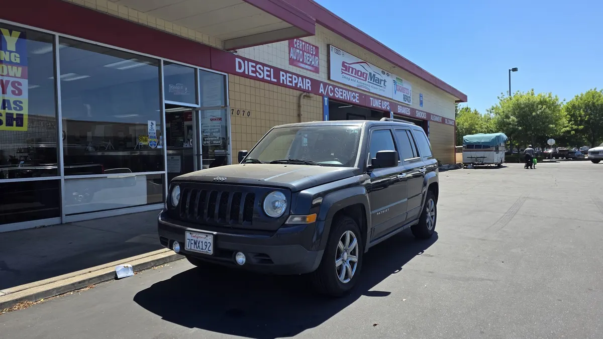 Jeep parked in front of Smog Mart in Sacramento