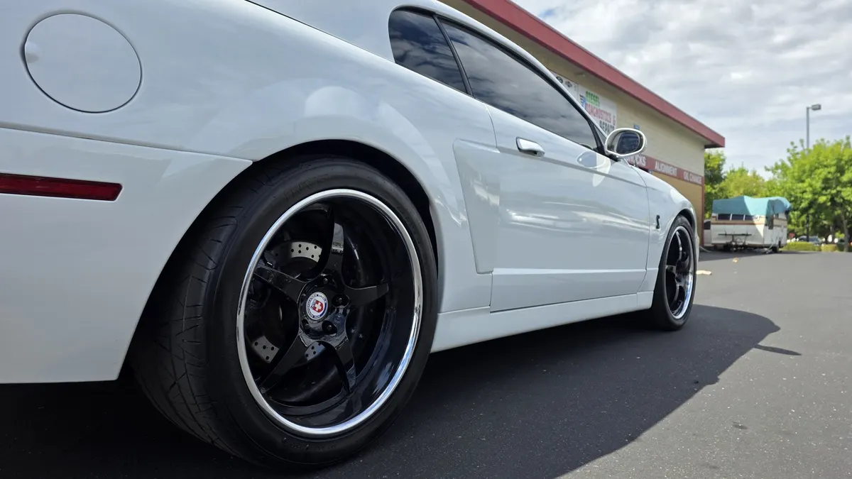 Shelby GT500 parked outside the Smog Mart service bays on Stockton Blvd