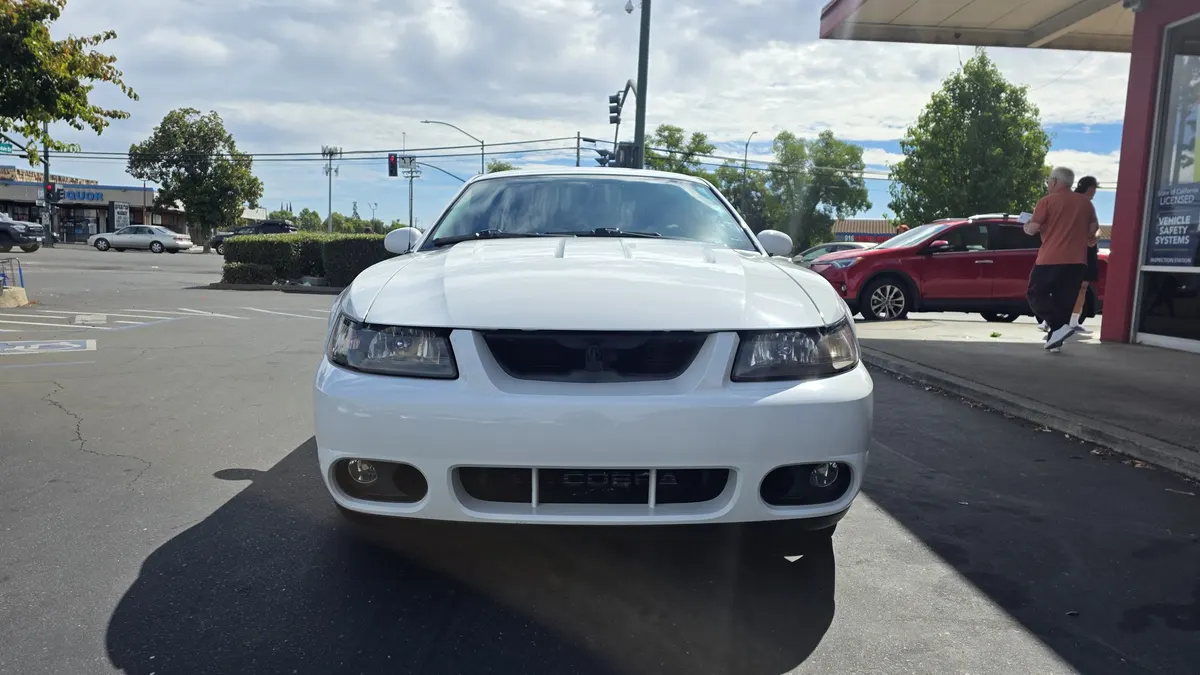 Shelby Mustang in the Smog Mart service bay